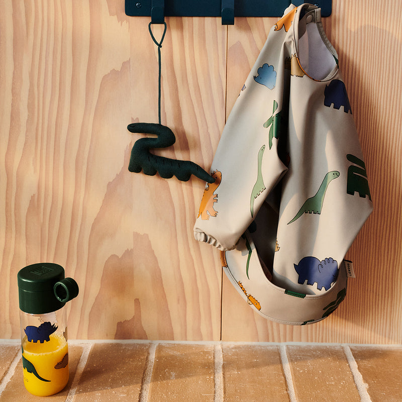 Langarm-Lätzchen Merle Printed Cape Bib Dinosaurs / Mist